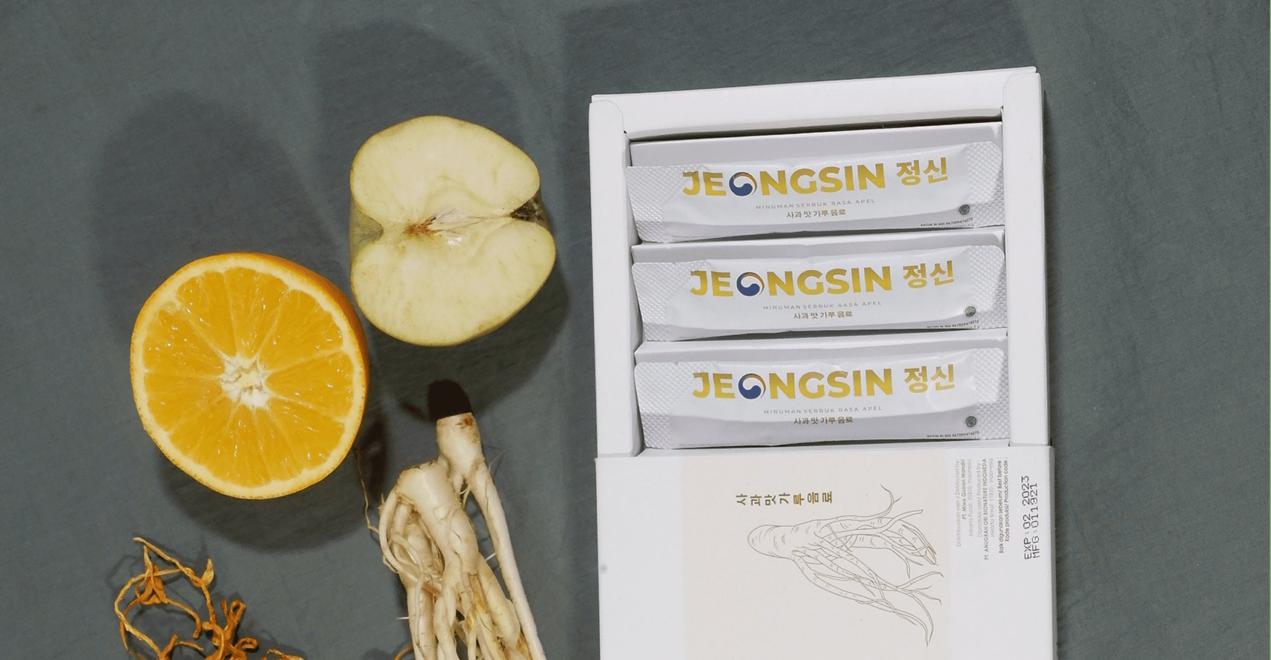 Produk Jeongsin – kotak suplemen vitalitas dengan latar belakang hijau